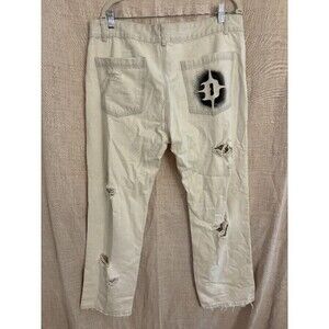 Darker Wavs shredded jeans